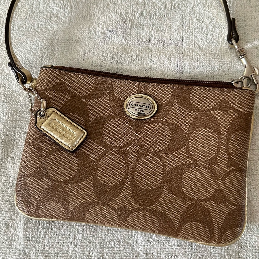 Coach brown and tan wristlet